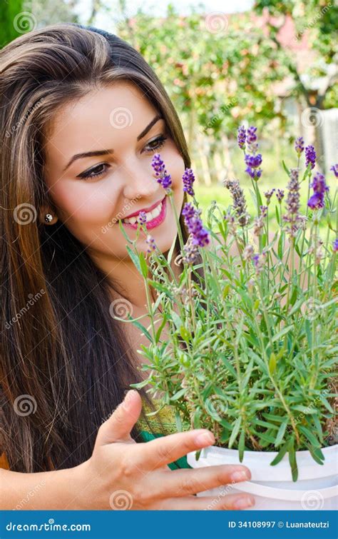 Beautiful Woman In The Garden With Flowers Royalty Free Stock
