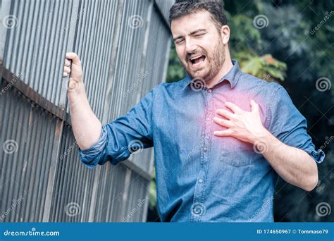 Man Suffering From Chest Pain Having Heart Attack Or Painful Cramps