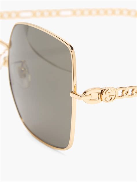 Gucci Gg Chain Charm Square Metal Sunglasses In Black Gold Metallic