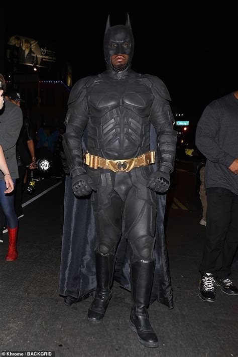 diddy transforms into batman as he arrives at halloween party in a batmobile while chloe bailey