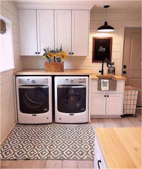 Again, the washer and dryer are front loading, which allows space above them for shelves that hold attractive wicker baskets and apothecary jars and bowls filled with laundry materials. unfinished basement laundry room ideas, laundry room ...