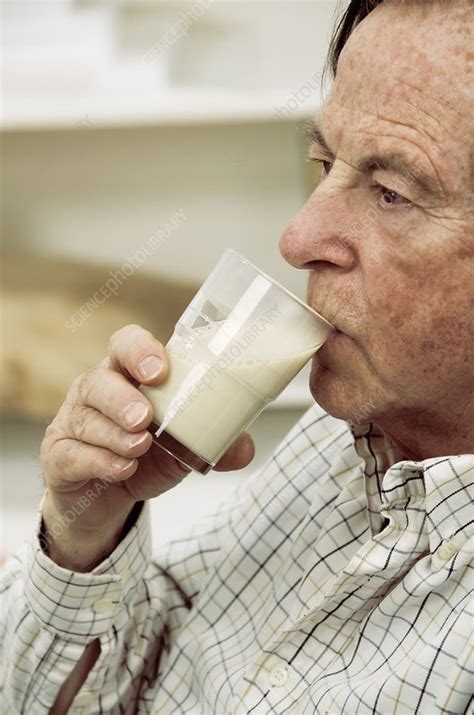 Elderly Man Drinking Milk Stock Image C009 5744 Science Photo Library