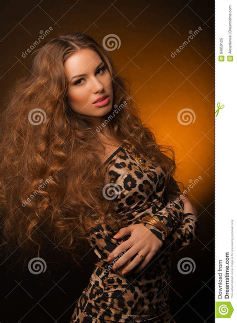 Girl In Leopard Dress And Black Shoes On Brown Background Stock Image Image Of Beautiful