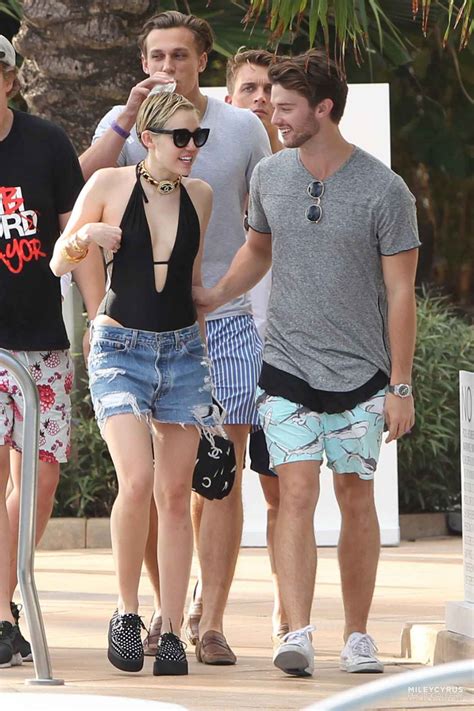 Miley Cyrus At A Pool In Miami With Her Boyfriend December 2015