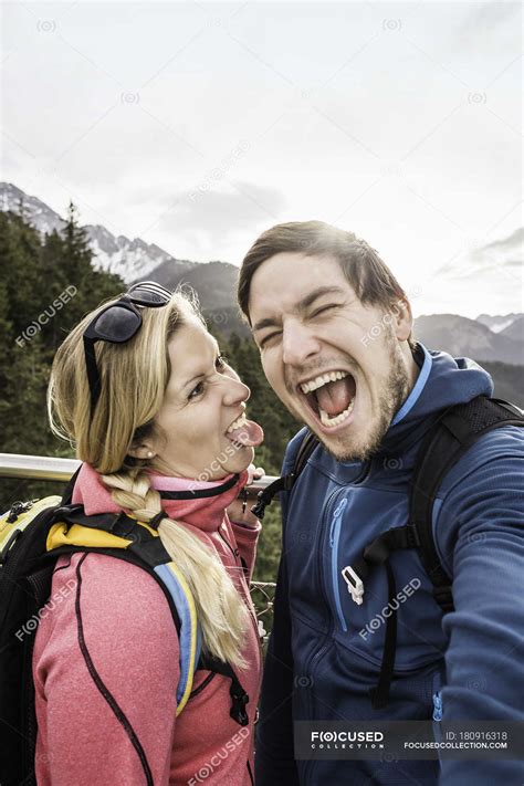 Young Hiking Couple Posing For Selfie In Mountains Reutte Tyrol