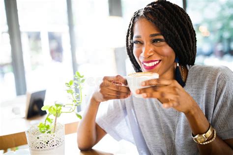Portrait Of An African American Woman Relaxing At Cafe With Coffee Stock Image Image Of Person