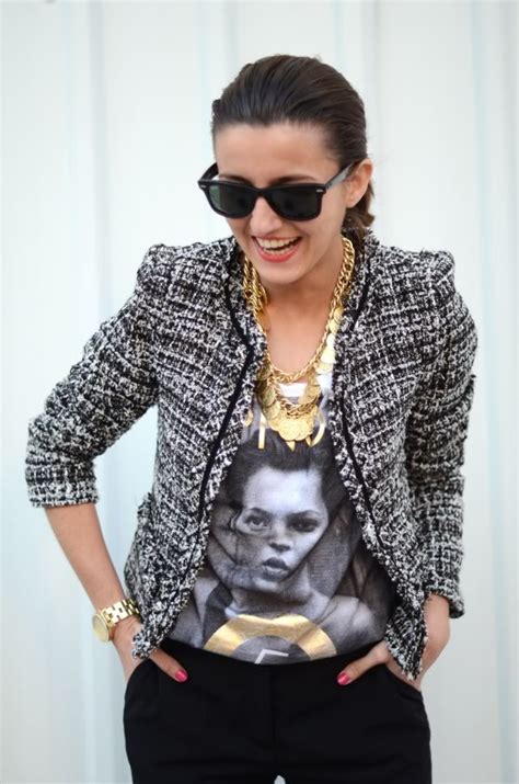 A Woman Wearing Sunglasses And A T Shirt With An Image On It