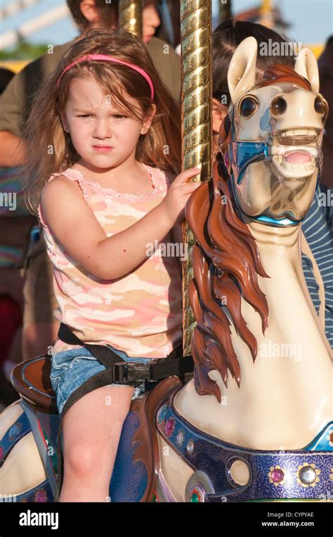 Young Girl Riding The Merry Go Round At The Annual Great Circus Parade Milwaukee Wisconsin