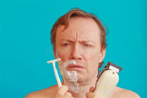 A Man To Shave Must Choose Between The Razor And The Razor Blade Stock