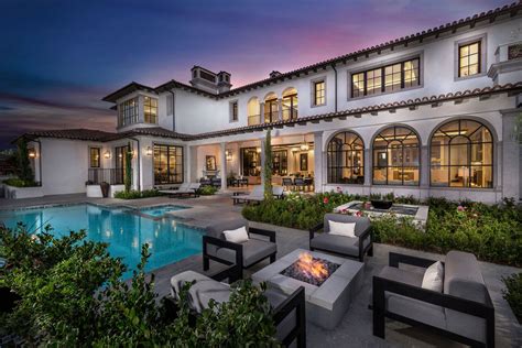 An Image Of A House With A Pool And Fire Pit In The Middle Of It