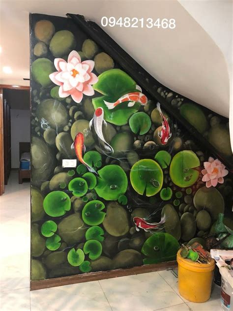 A Painting On The Side Of A Wall With Koi Fish And Lily Pads