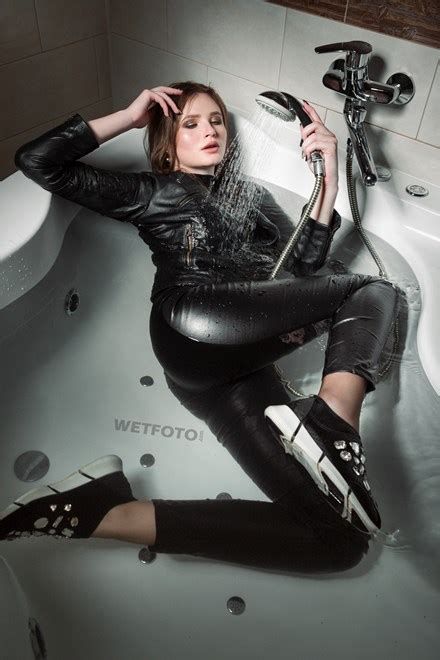 sexy girl in leather jacket and leggings smokes in jacuzzi wetlook one