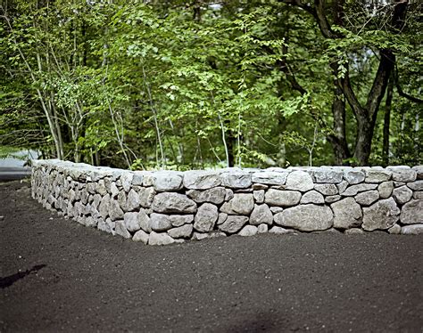 A Freestanding Mortared Fieldstone Wall Blends Strength With The