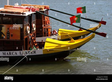 Typical Douro Oporto Portugal Boats With The Portuguese Flag Stock