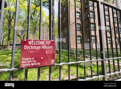 Sign On The Fence Of The Dyckman Houses Housing Project In Northern