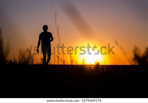 Silhouette Man Walking Sunset Stock Photo 1079609576 Shutterstock