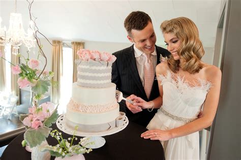 vintage chic bride and groom cut wedding cake