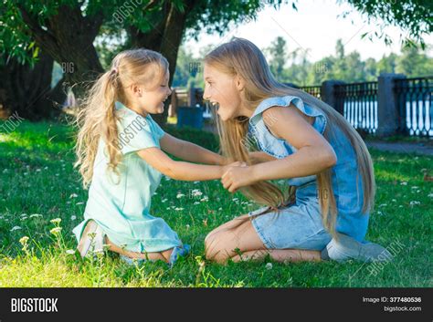 Two Sisters Playing Image And Photo Free Trial Bigstock