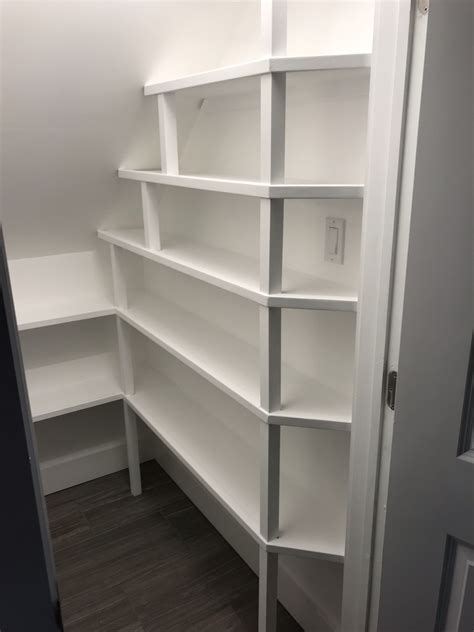 We also decided that at the same time we would also organize the small pantry in we installed the shelves on the back of the closet under the stairs first, and then we worked our way forward. Under Stairs Emergency Food Pantry Shelves DIY Project | The Homestead Survival