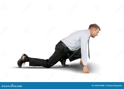 Caucasian Businessman Kneeling In The Studio Stock Photo Image Of