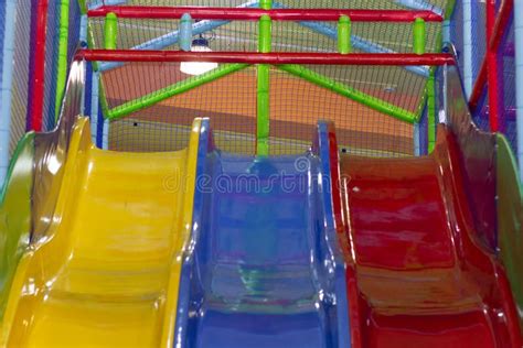 Three Colorful Slides For Children In Play Center Stock Image Image