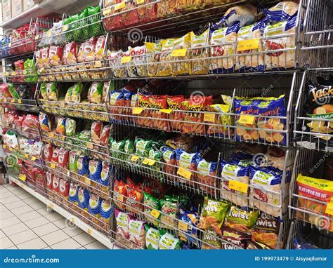 Packed Miscellaneous Junk Foods And Snacks On Rack And Display On The