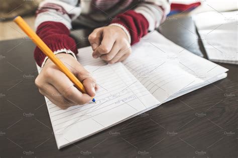 Child Write In A Notebook High Quality Education Stock Photos