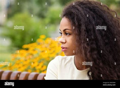 Side View Closeup Portrait Of Young African American Woman With Loose