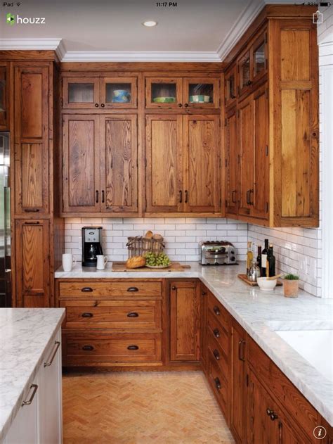 Using a paint brush works really well for simple cabinet designs, and it is easily the least complicated method. Rich oiled wood shaker cabinets with white tile backsplash ...