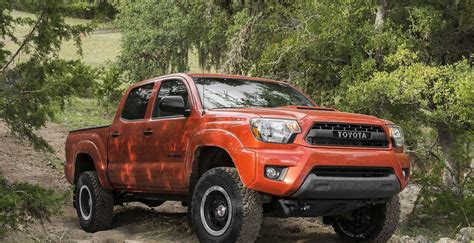Download A Toyota Tacoma Parked In A Beautiful Location Overlooking