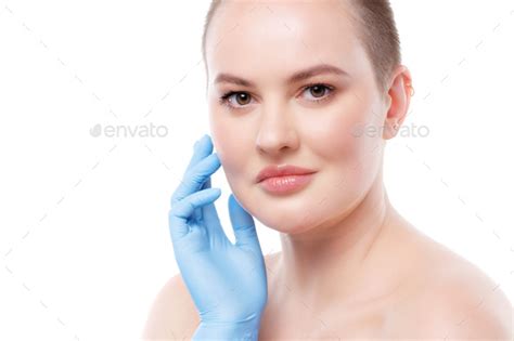 Portrait Of A Nude Short Haired Woman In Sterile Gloves Stock Photo By Fabrikaphoto