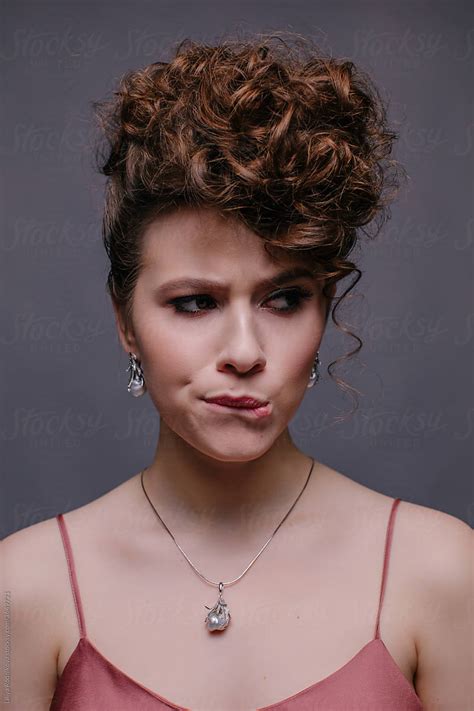 Nervous Female Model Biting Lip By Stocksy Contributor Liliya