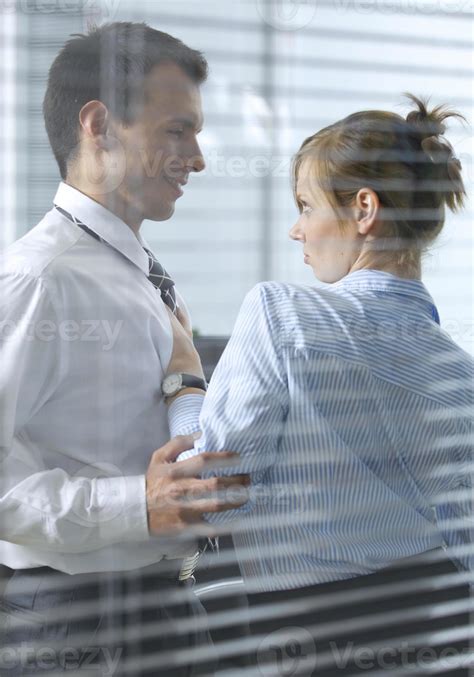 Businesswoman Flirting With His Colleague In Office 873792 Stock Photo