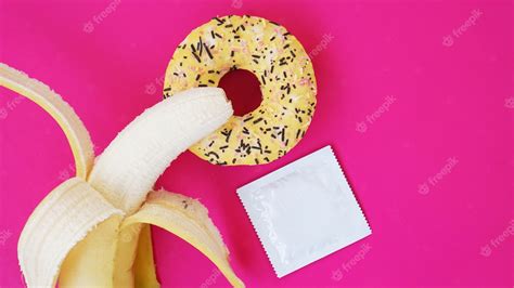Premium Photo Banana Donut And Condom Sex Idea Bright Picture On A
