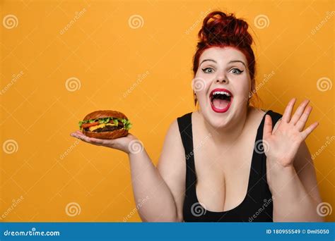 happy overweight fat woman happy hold big burger cheeseburger sandwich girl on diet dieting
