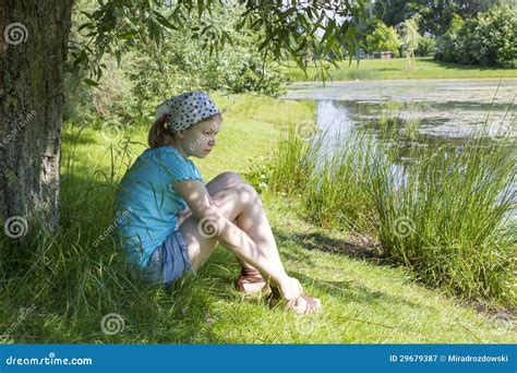 Girl Sitting By The Water Stock Image Image Of Grass 29679387