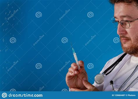 Doctors Hand Holding Syringe Are Preparing To Injection Stock Image