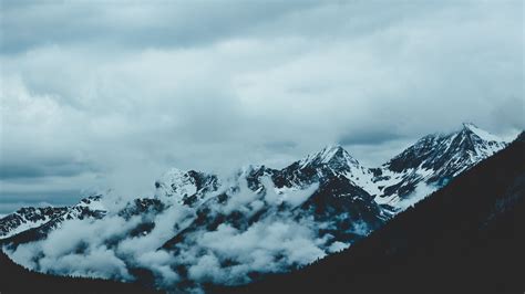 Download Wallpaper 1920x1080 Mountains Fog Sky Peaks Snow Covered