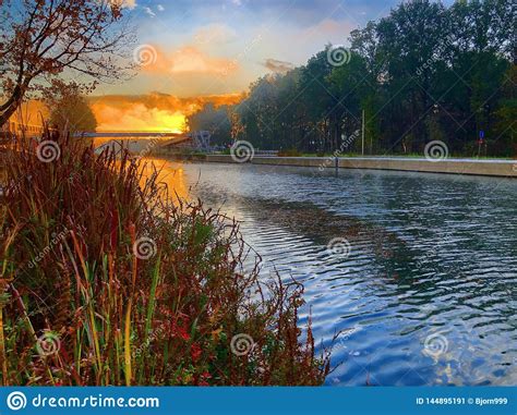 Dramatic And Colorful Sunrise Over A Beautiful River Landscape Stock