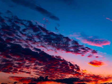 Red Sunset On A Cloudy Blue Sky With Clouds Stock Photo Image Of