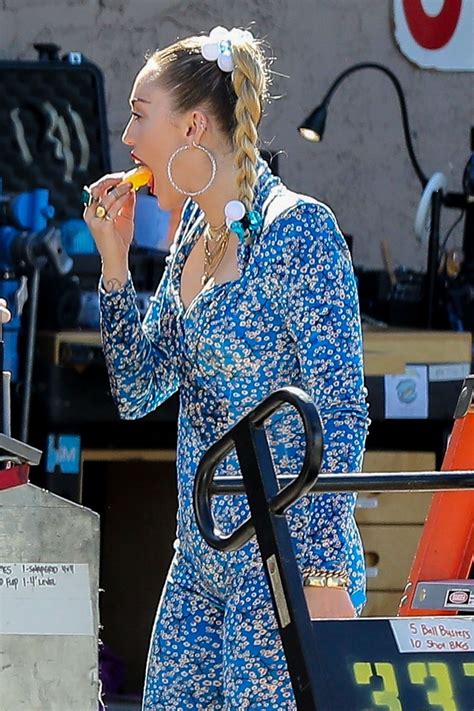 See more of 1mdb on facebook. Miley Cyrus in a Blue Floral Jumpsuit On Set of Her Latest ...