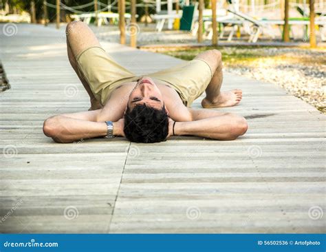 Young Man Lying On Back On Sun Deck Stock Photo Image Of Male Person