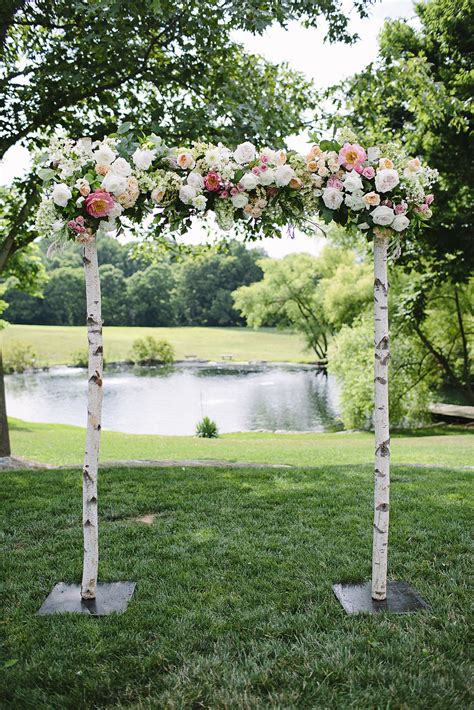 Elegant And Contemporary Summer Farm Wedding Wedding Arches Outdoors