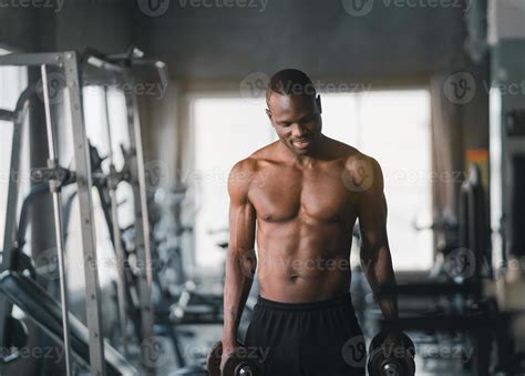 African Sport Man Strong Muscle Working Out Excercise In Weights With