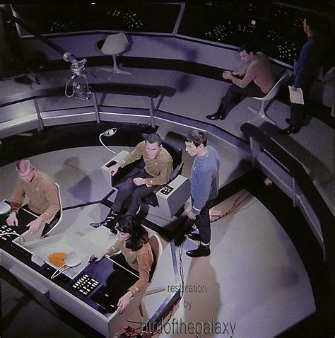 Several People Are Sitting Around In The Middle Of A Round Table