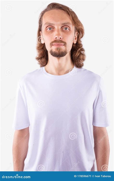 Caucasian Man Standing Straight And Looking Directly At Camera White