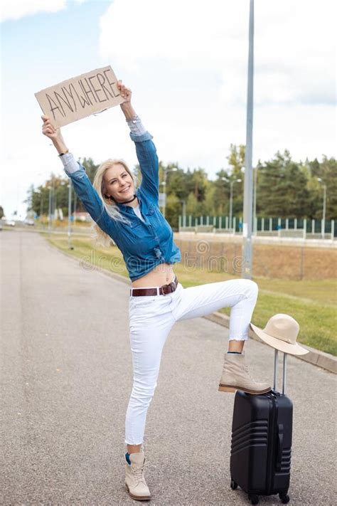 Vertical Begging Positive Laughing Blond Woman Autostopping Holding Cardboard Plate Anywhere