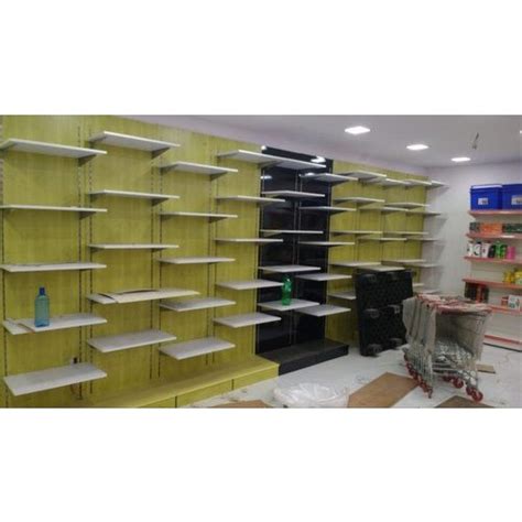 Wall mounted display rack , made by metal or wooden , full range wall panel ,usually use for shoes display , some style with hooks used for clothes or hat or garment shop wall mounted display fixture for child clothes. Wall Mounting Wooden Retail Display Racks for Showroom, Rs ...