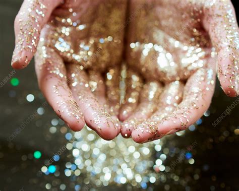 Hands Cupping Gold Glitter Stock Image F0206550 Science Photo
