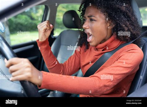 Rude Black Woman Driver Arguing And Driving Car Stock Photo Alamy